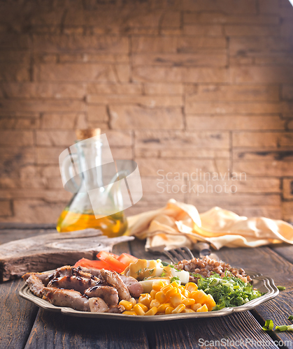 Image of salad with meat and vegetables on plate