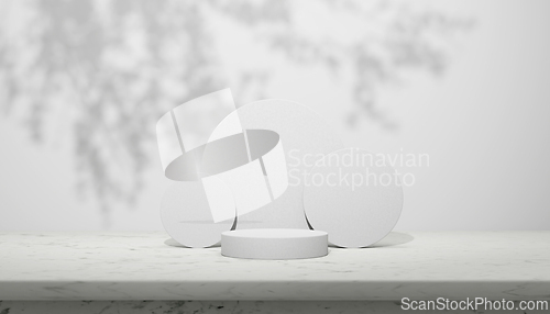 Image of Luxury marble table with plant shadow on white wall and cylinder