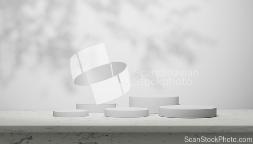 Image of Luxury marble table with plant shadow on white wall and cylinder