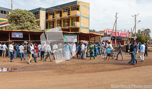 Image of The town center features both modern construction and improvised market stalls, full of local people. Fenote Selam, Ethiopia