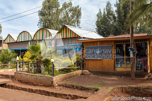 Image of Colorful, improvised architecture of roadside commercial stalls in Fenote Selam. Fenote Selam, Ethiopia