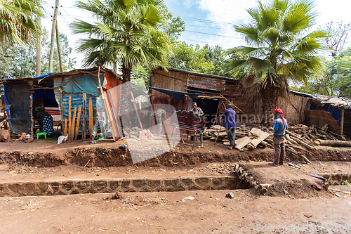 Image of Small, improvised woodworking and furniture repair shops operate by the roadside in Fenote Selam. Fenote Selam, Ethiopi