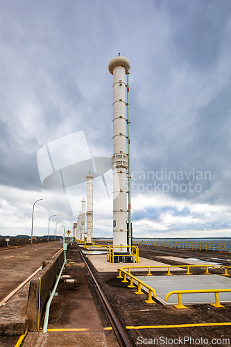 Image of View of the giant water intake towers and safety railings on the crest of the world-famous Itaipu Dam. Itaipu Binacional, Brazil