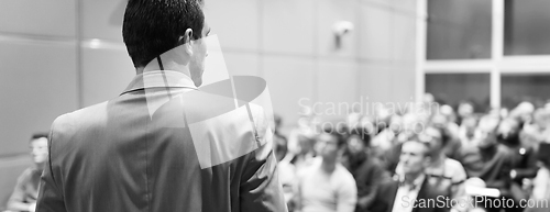 Image of Speaker at Business Conference and Presentation.