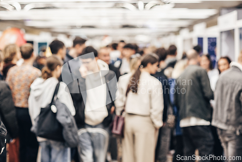 Image of Abstract blurred people at exhibition hall of expo event trade show. Business convention show or job fair. Business concept background.