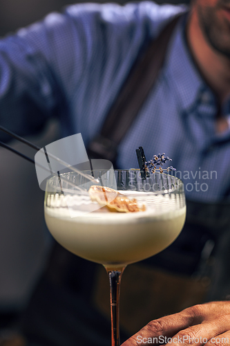 Image of Bartender garnishing cocktail