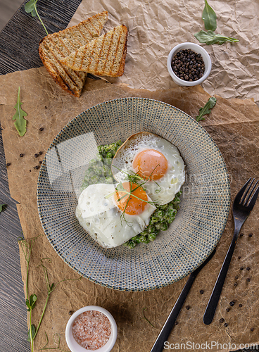 Image of Fried eggs with green peas
