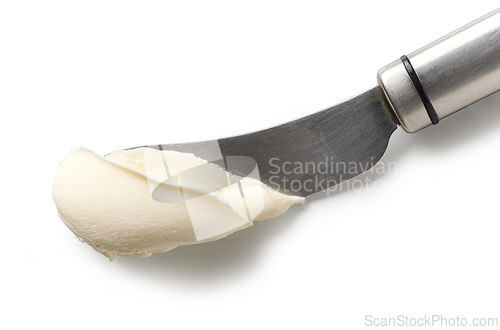 Image of fresh cream cheese on knife