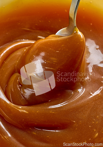 Image of freshly cooked caramel sauce background