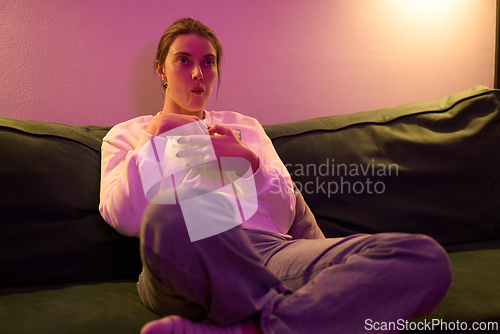 Image of Relaxed Nighttime Snacking in Soft Colored Light