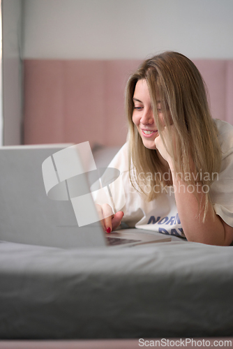 Image of Relaxed Morning Browsing in Soft Bedroom Light