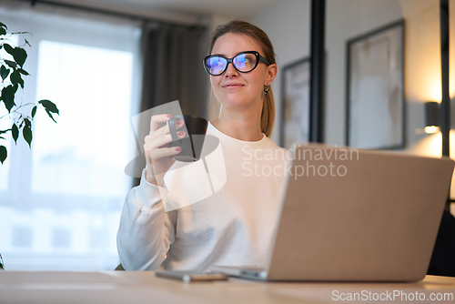Image of Soft Smile During a Warm Break from Remote Tasks