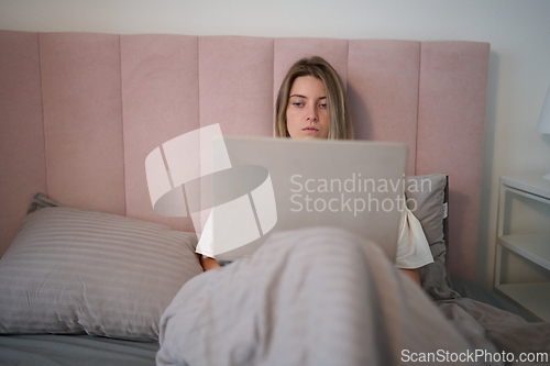 Image of Quiet Morning Productivity in a Soft Bedroom Setting