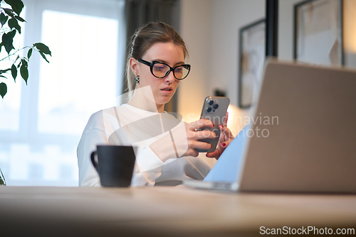 Image of Intense Digital Check Amid a Bright Home Office Scene