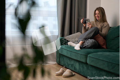 Image of Soft Morning Light Framing a Relaxed Moment on the Sofa