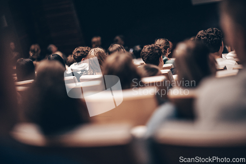 Image of Rear view of unrecognizable people in audience at the conference hall. Business and entrepreneurship symposium.