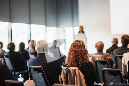 Image of Woman giving presentation on business conference event.