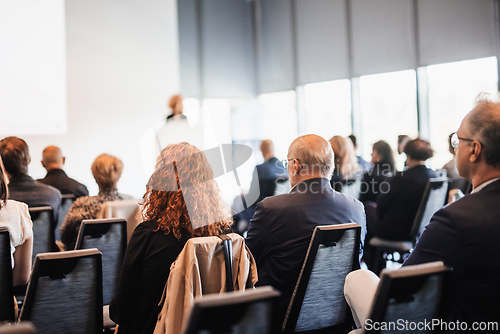 Image of Woman giving presentation on business conference event.
