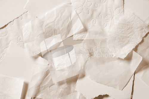 Image of various beige color torn paper background