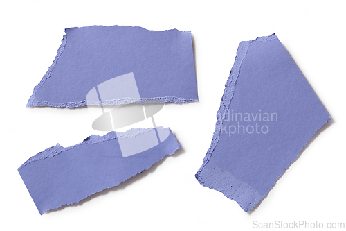 Image of blue color torn paper pieces