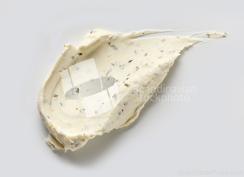 Image of fresh cream cheese with greens and garlic