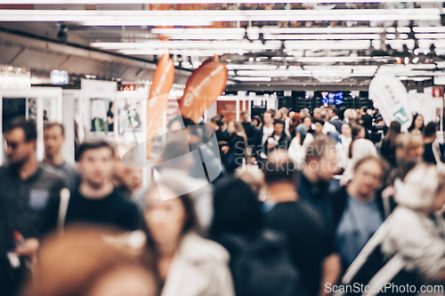 Image of Abstract blurred people at exhibition hall of expo event trade show. Business convention show or job fair. Business concept background.