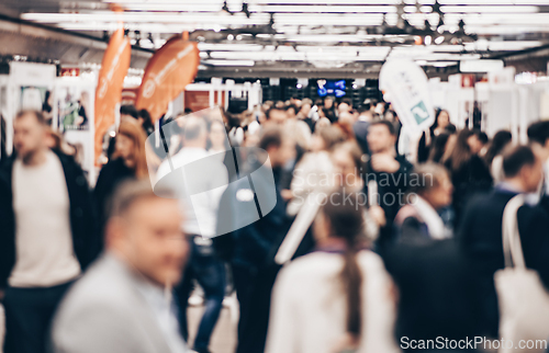 Image of Abstract blurred people at exhibition hall of expo event trade show. Business convention show or job fair. Business concept background.