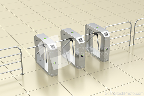 Image of Row of three electronic turnstiles on tiled floor