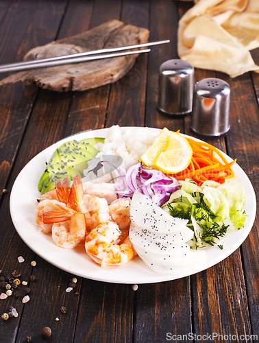 Image of Shrimp poke bowl with avocado, cucumbers and rice, diet food
