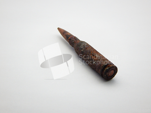 Image of Rusty weapon cartridge.
