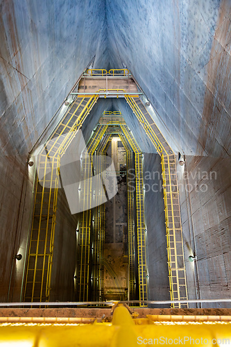 Image of Central access shaft, highlighting the immense vertical scale of the dam inner structure. Itaipu Binacional, Brazil
