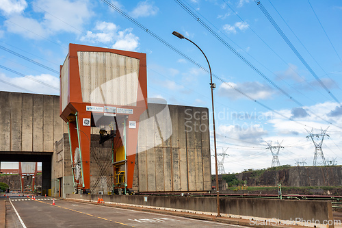 Image of Colossal gantry crane used for heavy maintenance is situated by massive concrete wall of the Itaipu Dam. Itaipu Binacional, Brazil