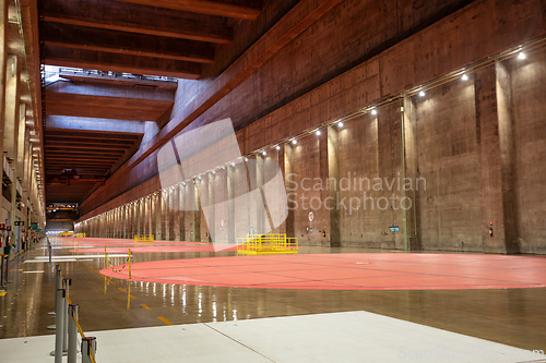 Image of Immense hall inside binational facility, highlighting scale needed for generator assembly and repair. Itaipu Binacional, Brazil