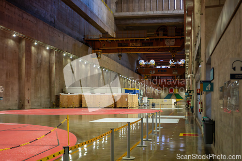 Image of Immense hall inside binational facility, highlighting scale needed for generator assembly and repair. Itaipu Binacional, Brazil