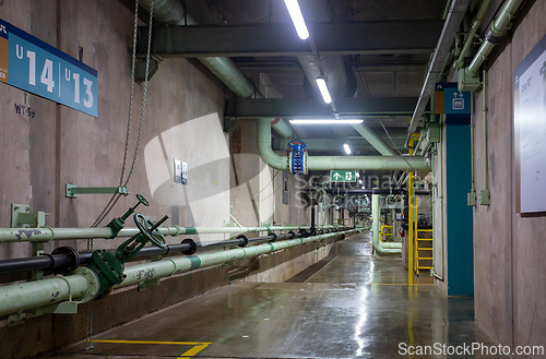 Image of Infrastructure of binational facility, showing pipes and unit numbers for operational purposes. Itaipu Binacional, Brazil