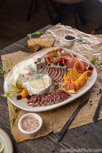 Image of Deluxe charcuterie board showcasing gourmet meats