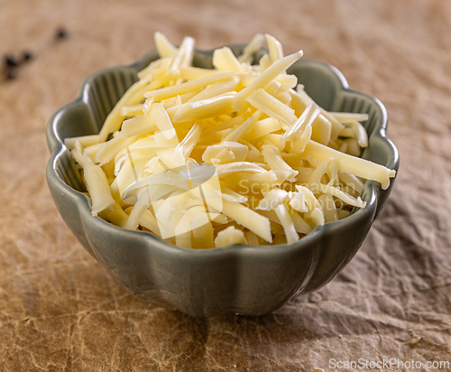 Image of Shredded cheese filling a bowl