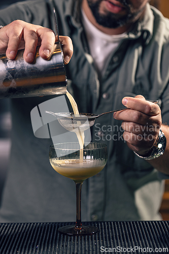 Image of Professional bartender preparing a drink
