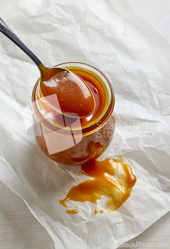 Image of freshly cooked homemade caramel sauce in jar