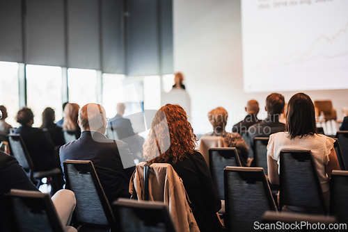 Image of Woman giving presentation on business conference event.