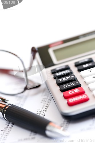 Image of Tax calculator pen and glasses