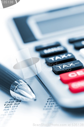 Image of Tax calculator and pen