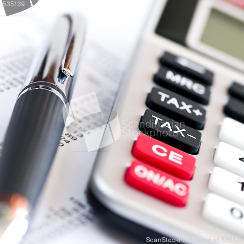 Image of Tax calculator and pen