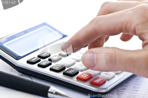 Image of Tax calculator and pen