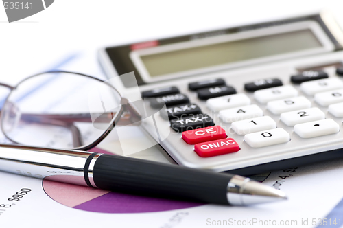 Image of Tax calculator pen and glasses