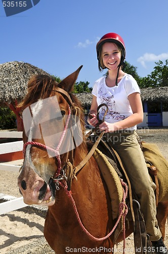 Image of Girl riding horse