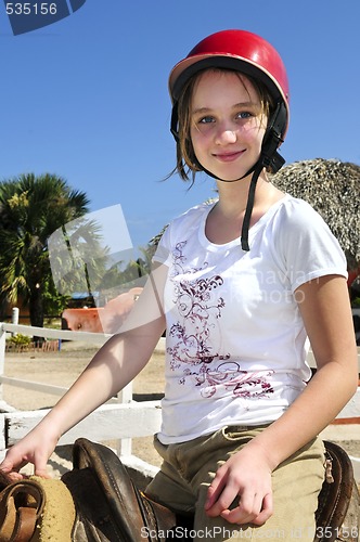 Image of Girl riding horse