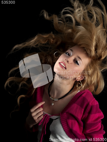 Image of Teen beauty shaking hair