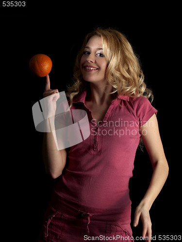 Image of Teen beauty spinning orange