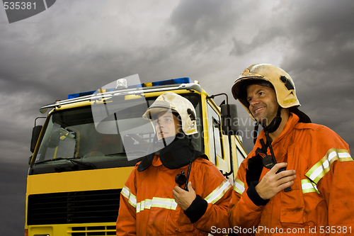 Image of two smiling firemen